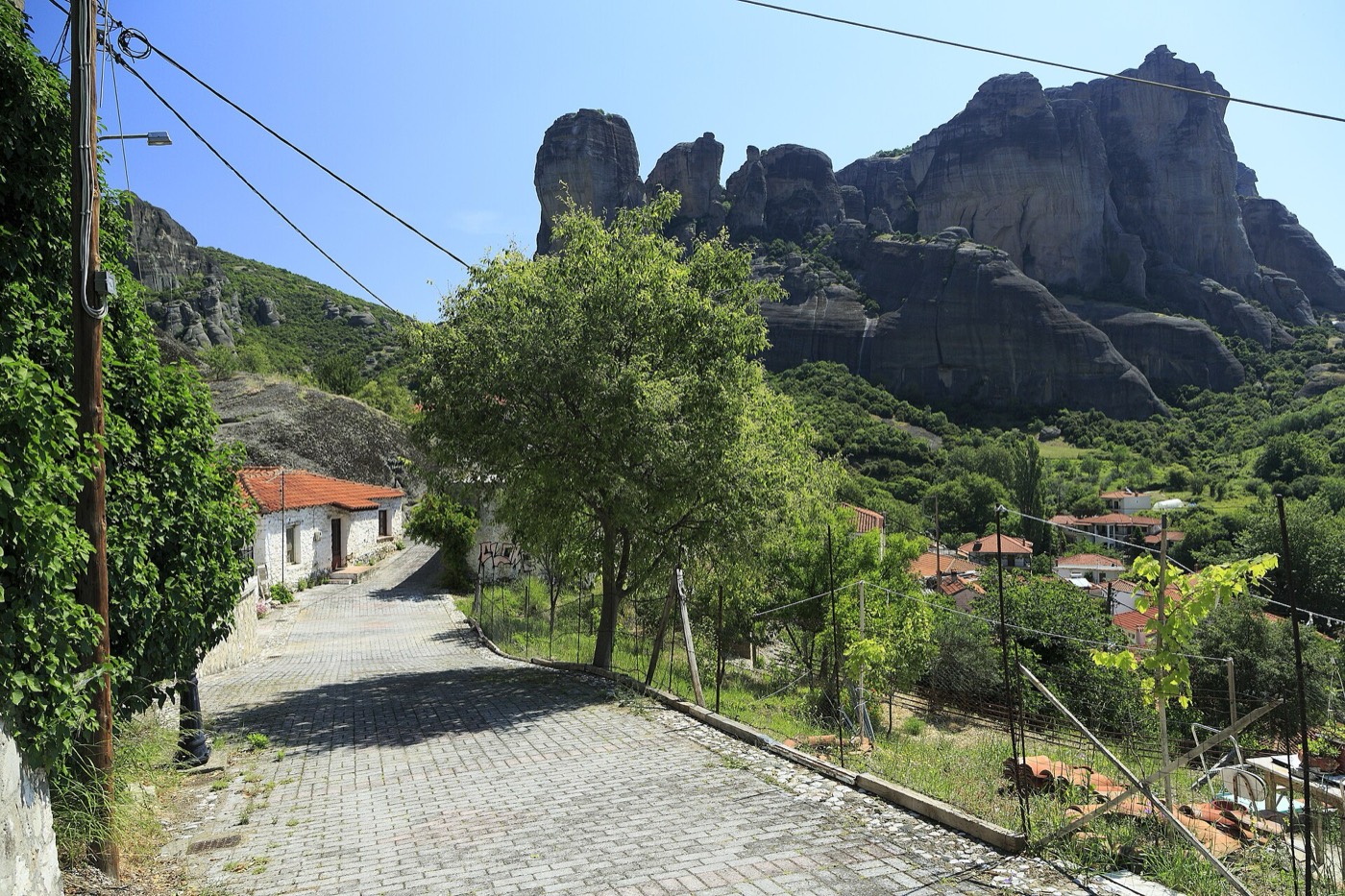 Village street toward the Meteora rocks in Kalambaka